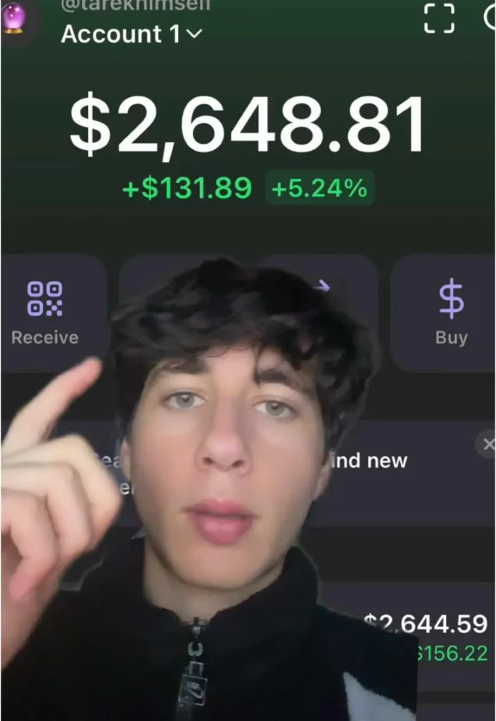 Young man foregrounds a screen showing an account balance of 