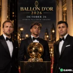 Three men in tuxedos pose around a gold Ballon d'Or trophy on a marble pedestal at the 2026 Ballon d'Or ceremony at the London Palladium.